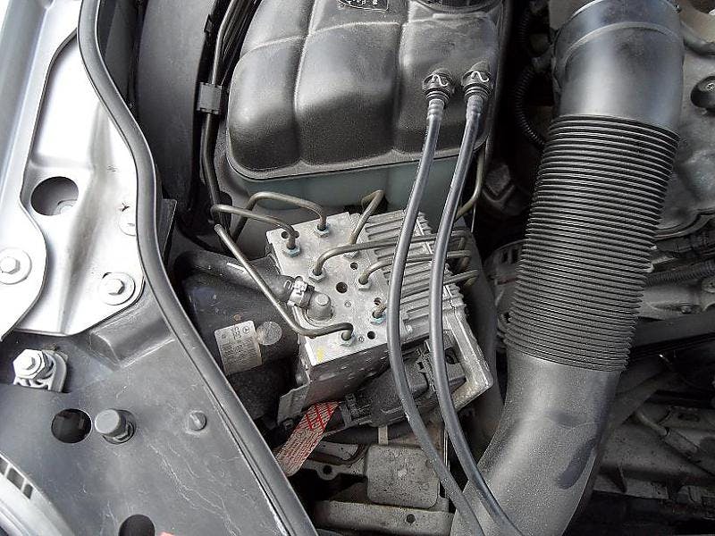 SBC unit in the engine compartment of a Mercedes Benz